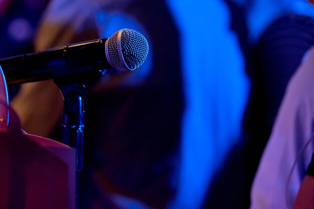 Modern microphone in karaoke club. Space for text. High quality photo
