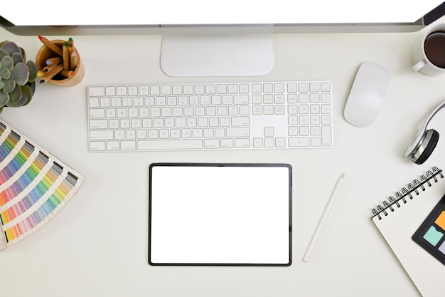 Modern minimal white graphic designer office desk top view with digital tablet mockup