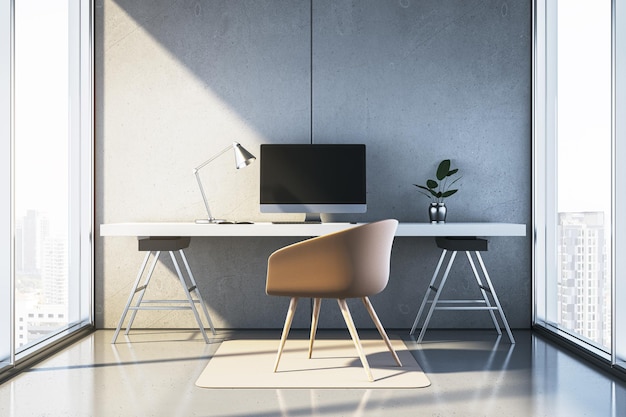 modern minimalist workspace with desk chair computer and lamp in bright room with concrete walls and large windows 3d rendering