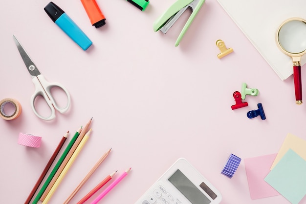 Modern mock up flat lay of notebook and stationery on pink background - Concept of creative work space