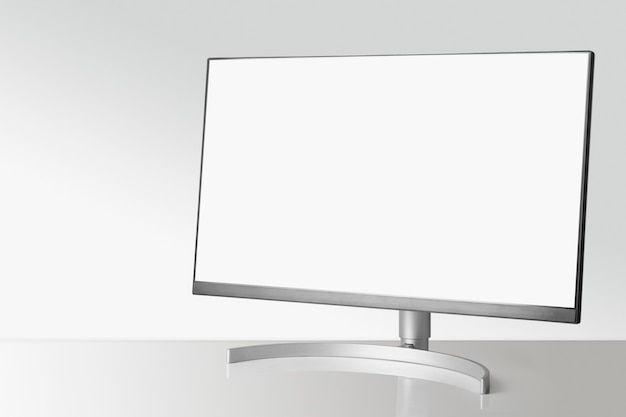 Modern monitor on white table and light