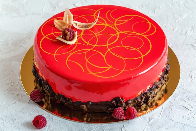 Modern mousse cake with glaze and chocolate decoration