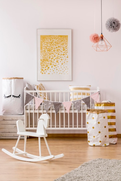 Modern newborn corner with golden decor