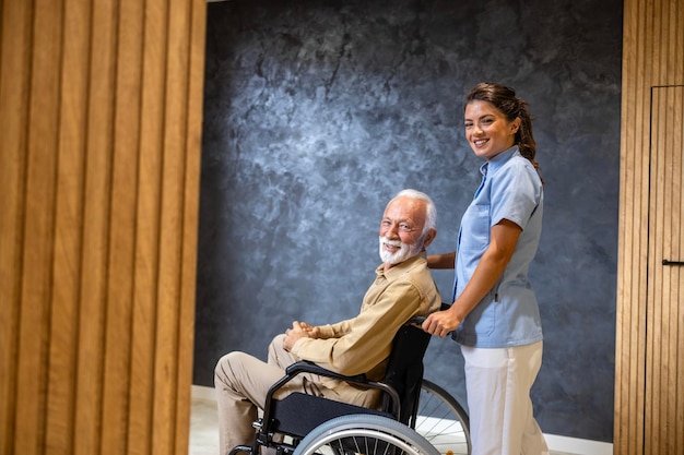 Photo modern nursing home and female nursing assistant taking care of elderly man in wheelchair