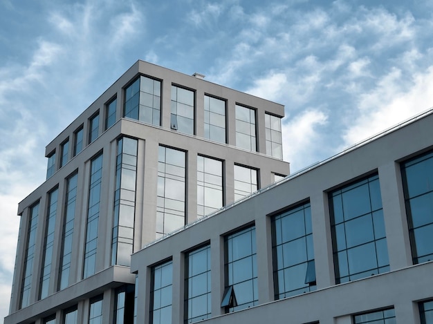 Modern office building in a corporate cityscape Commercial structure exterior sky Smart