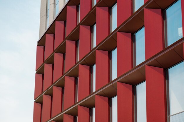 Modern office building exterior with glass facade on clear sky\
background transparent glass wall