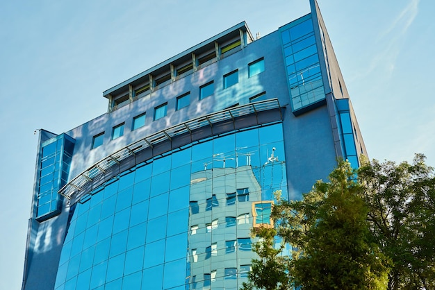 Modern office building with green trees