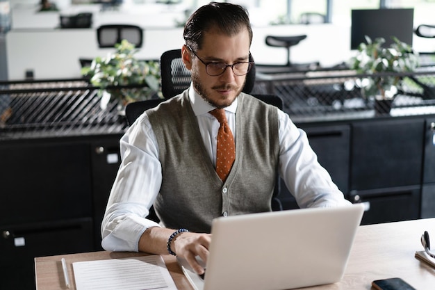 Modern Office Businessman Working on Computer Portrait of Successful Middleaged IT Software Engineer Working on Laptop