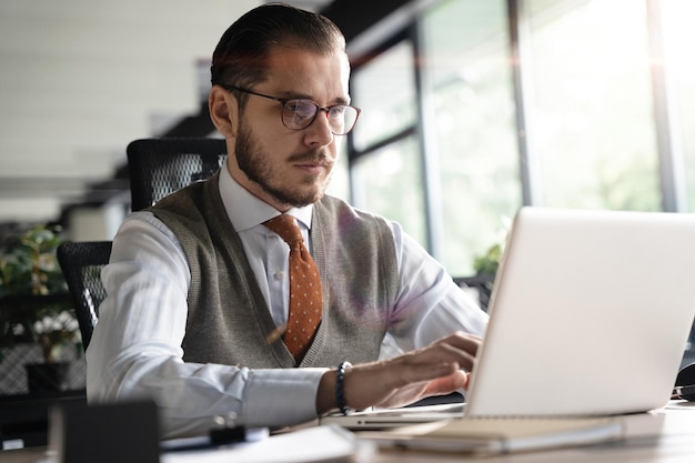 Modern Office Businessman Working on Computer Portrait of Successful Middleaged IT Software Engineer Working on Laptop