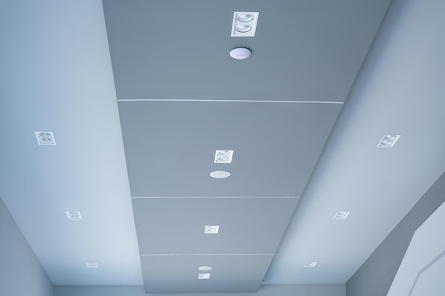 Modern office ceiling with LED light bulb on corridor