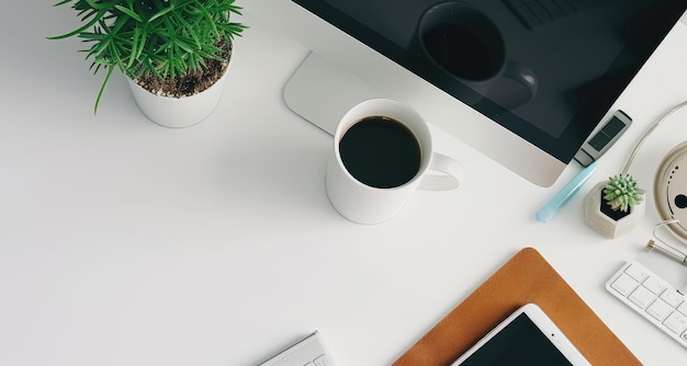 Photo modern office desk setup with computer and coffee