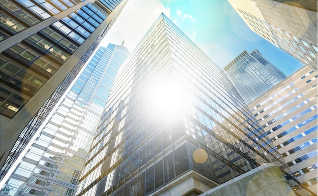 Modern office glass buildings over sky background