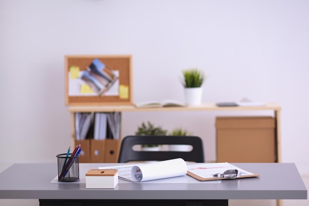 Modern office interior with tables chairs and bookcases