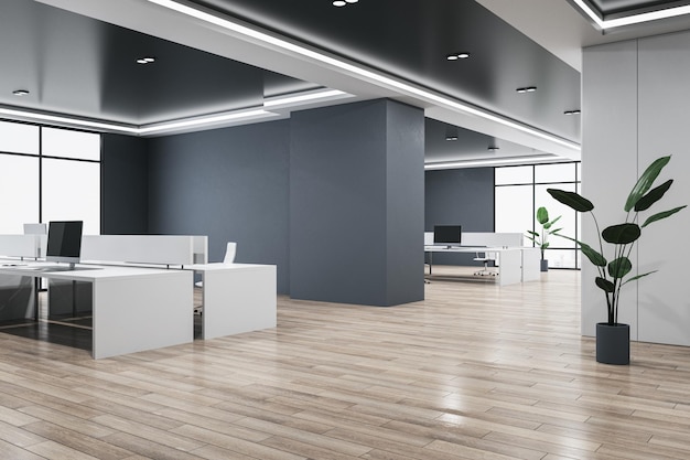 A modern office space with a white desk and a plant on the wall.