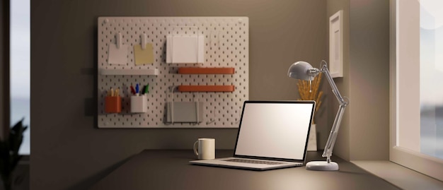 Photo modern office studio interior with notebook laptop mockup table lamp and stuff on modern grey table