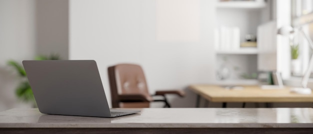 Modern office tabletop with laptop computer