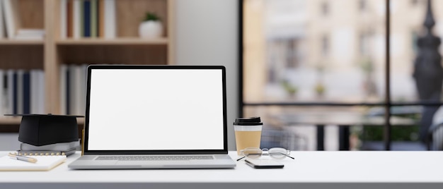 Modern office workplace tabletop with portable notebook laptop and stuff