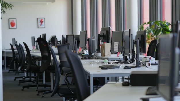 modern open office space with white walls and natural light concept of workspace productivity