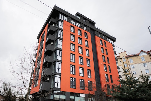 Modern orange residential multistory apartment buildings Facade of new houses