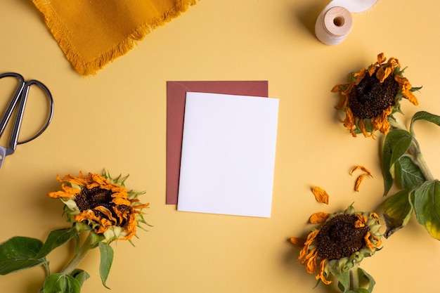 Modern paper art business card on light backdrop with sunflower Light yellow background Modern business flower store concept