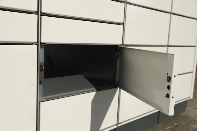 Modern parcel locker with open box closeup view