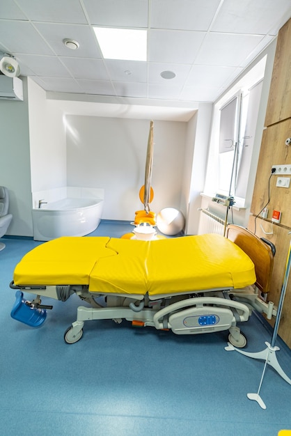 Modern patient beds in a maternity ward hospital baby health\
care