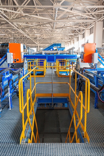 A modern plant for sorting and recycling household waste and\
waste. large industrial complex of conveyors, bunkers.