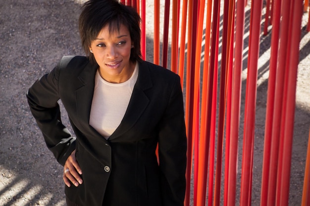 Modern portrait of a young professional business woman in urban setting.