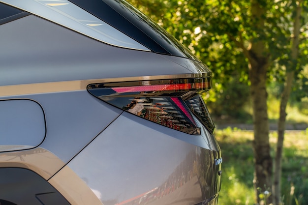 Modern rear light of a car. Brake light and arrow of large suv. Rear light of car close up view. Tail light.