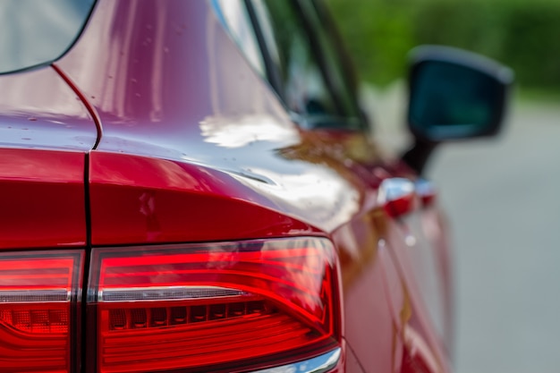 Modern rear light of a car. Brake light and arrow of large suv. Rear light of car close up view. Tail light.