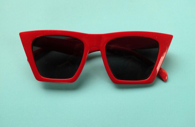 Modern red sunglasses fashion isolated on blue pastel background