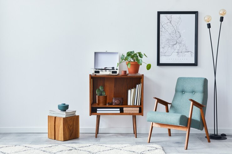 Modern retro composition of living room interior with design wooden cabinet, stylish armchair, poster map, plants, vinyl recorder, books and personal accessories in home decor.