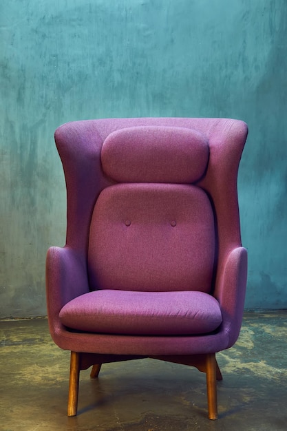 Modern retro magents chair near blue grange wall