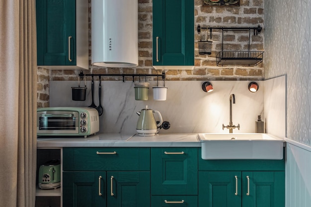 Modern retrostyle kitchen with green cabinets and brick walls