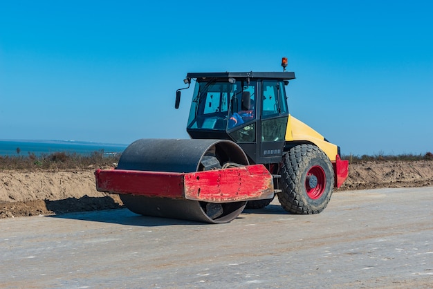 Modern road construction equipment roller for tamping and compacting asphalt, soil and other surfaces