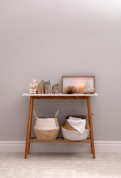 Modern room interior with table near light wall