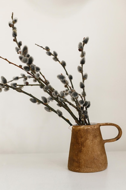 Modern rustic Easter still life Pussy willow branches in home spring decor Easter aesthetic