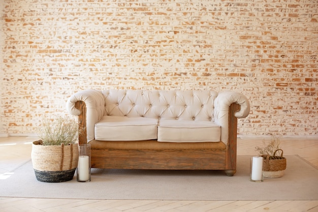 Modern Rustic living room interior with white sofa and wicker baskets with dried flowers