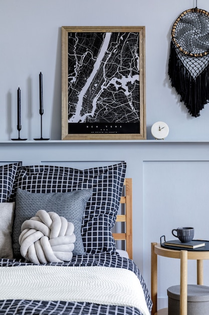 Modern scandi home interior with mock up poster frame wooden commode and personal accessories