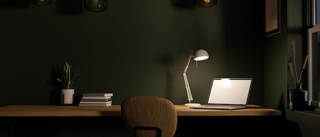 Modern scandinavian dark office workspace with laptop under\
lights from table lamp on wood table