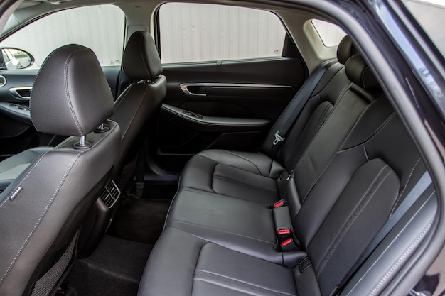 Modern sedan car inside. leather back passenger seats in modern\
luxury car. comfortable leather seats.