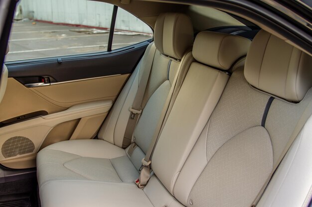 Modern sedan car inside. leather back passenger seats in modern
luxury car. comfortable leather seats.