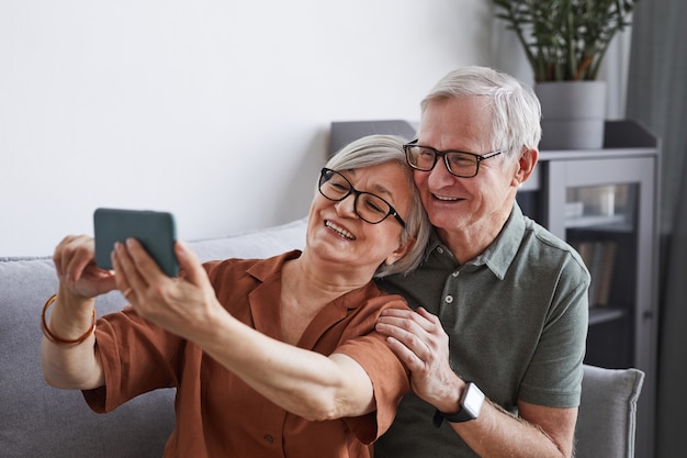 Modern Senior Couple Taking Selfie