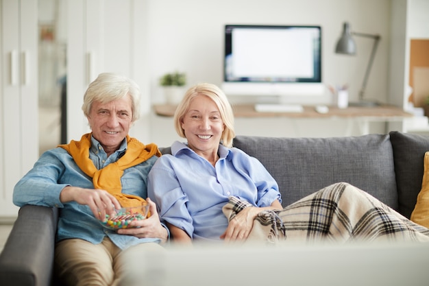 Modern Senior Couple Watching TV