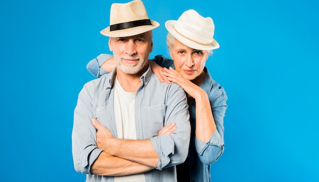 Modern senior couple wearing hats