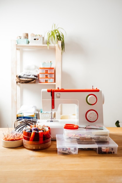 Modern sewing machine with variety of threads in box