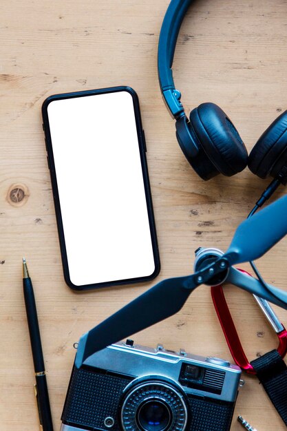 modern smartphone with travel items blank screen phone display