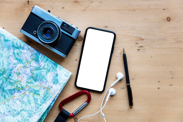 modern smartphone with travel items blank screen phone display