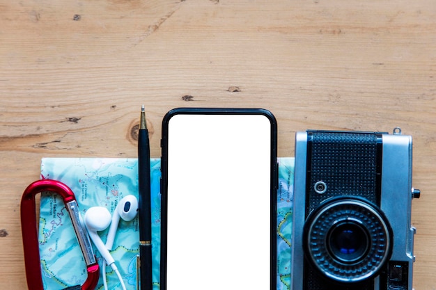 modern smartphone with travel items blank screen phone display