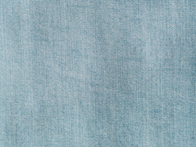 Modern soft jeans blouse texture close up. Lyocell or tencel pattern - modern natural cellulose fabric blue denim color. Can use for design or text. Copy space